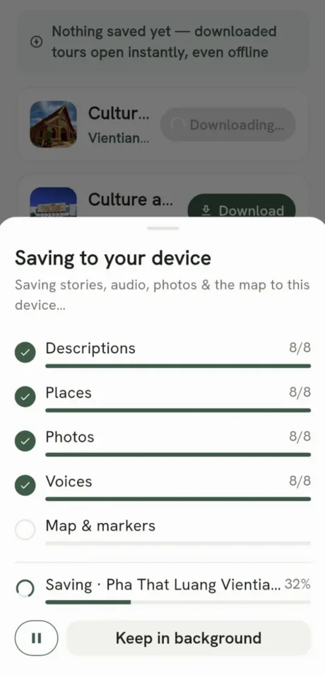 App screen: the download progress sheet saving descriptions, places, photos, voices and the map to the device, with a keep-in-background button